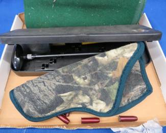 Lot 111. A soft pistol holster, 44 Mag Snap-Caps, and gun cleaning kit