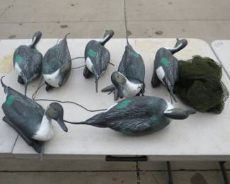 Lot 237. Seven pintail decoys (six with weights) and a decoy bag