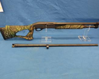 Lot 370. Remington 870 Express Magnum 12-gauge pump shotgun. Ser #C754414M. 2 3/4" with an 18" cyl. bore barrel. Also includes a 30" full choke barrel.