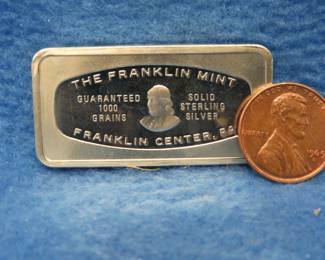 Lot 373. Franklin Mint Bank-marked sterling silver ingot. 65.2 grams.