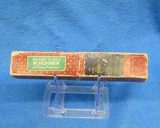 Lot 128. Hohner 32-hole tremolo harmonica in pre-war white. Sounds great. Box in good condition