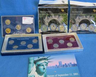 Lot 309. Collectible Quarter sets: 1999 D 5-quarter set, 2006P, Two Blue Ridge Parkway 3-quarter sets, 5-quarter 1999 set, Hero's album of September 11, 2001