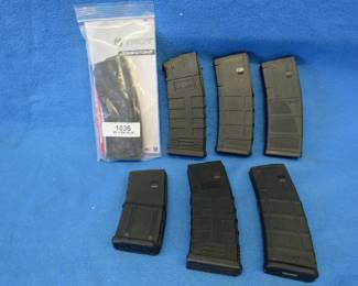 Lot 336. Six 30-round AR-15 magazines (one is loaded with .223 rounds) and one 20 round magazine