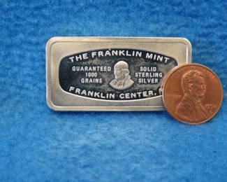 Lot 165. Franklin Mint Bank-marked sterling silver ingot. 65.1 grams.