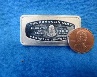 Lot 164. Franklin Mint Bank-marked sterling silver ingot. 65.3 grams.