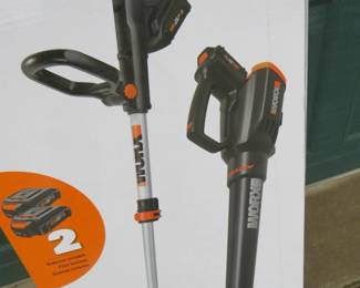 Lot 130. NIB Worx 20-volt cordless blower and trimmer/edger. Includes two batteries and charger.