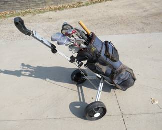 Lot 66. Ladies' RH golf clubs. Lady Viper irons 3-PW minus the 6, 3 metal woods, utility club, putter, ball retriever, and a pull cart