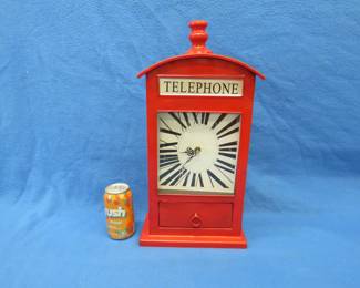 Lot 105. Telephone-themed battery-operated clock. Needs new battery.