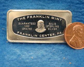 Lot 375. Franklin Mint Bank-marked sterling silver ingot. 65.4 grams.
