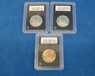 Lot 346. Two Statue of Liberty fifty-cent pieces. 1986 S and a 1986 D INB graded at PR70 or MS70