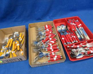 Lot 243. Red and Yellow handled silverware
