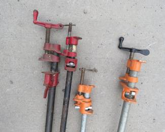 Lot 229. Four pipe clamps