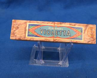 Lot 77. Hohner's Violetta tremolo enameled 28-hole harmonica. Sounds great. Box in excellent condition.