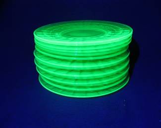 Lot 278. 14 Depression era green uranium glass plates. 7 each of two slightly different patterns. Just over 8".