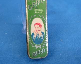 Lot 202. The Grand Band harmonica tin only. Unknown maker