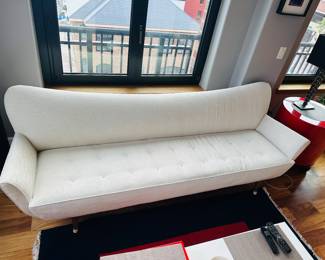 1950s Mid-century 9’ x 32” d x 33” t cream colored sofa; $8000