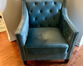 There are a pair of these blue velvet chairs with nailhead trim