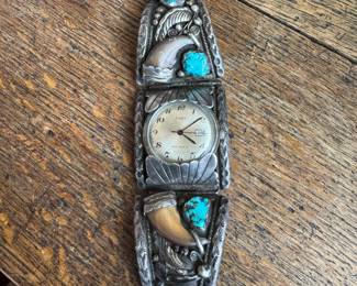Maybe Lonnie Yazzie. Well made rare watch with coral, turquoise and claws