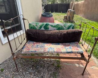 Antique iron crib made into outside seating bench