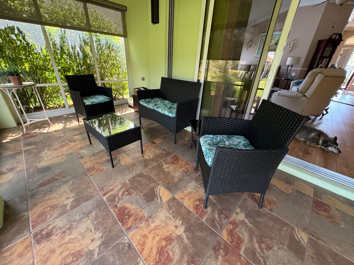 Lanai Seating Collection
This inviting set includes two cushioned chairs, a cozy settee, and matching coffee and end tables with elegant glass tops.
Designed for comfort and tropical charm, perfect for your patio or sunroom.