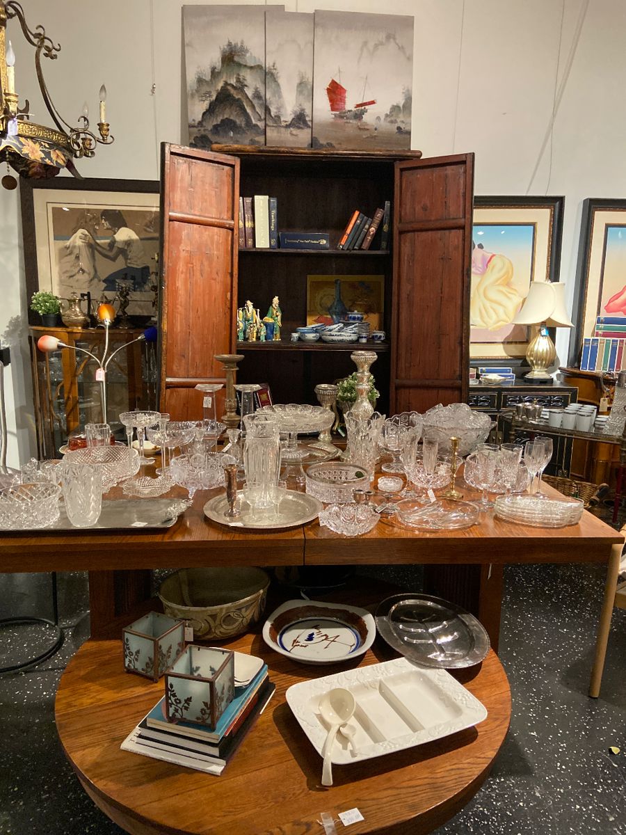 armoire, crystals, serving pates, lithograhs signed and numbered, chandelier, table, coffee table, table lamps