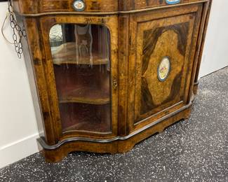 Antique cabinet with enameled accents