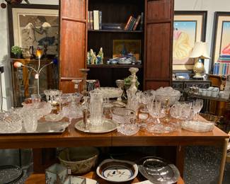 armoire, crystals, serving pates, lithograhs signed and numbered, chandelier, table, coffee table, table lamps