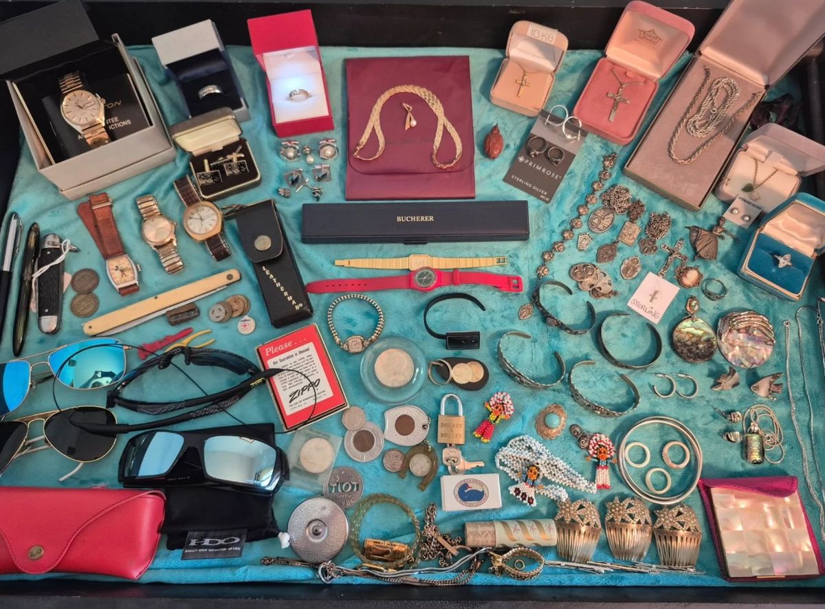 Never have I had such a full case! This is only one of five!  In this case we have 18K, 14K, and 10K. Beautiful Sterling Silver, Mother of Pearl, Abalone, and Turquoise. There is a mens Hamilton and Bulova 23 jewel watch and a womens Bucherer.  We have Ray Ban, Dooney & Bourke and Zippo among other great items.