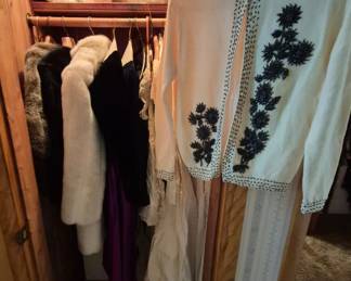 Gorgeous vintage clothing including wedding dresses, veil, bridesmaid dresses, and furs.