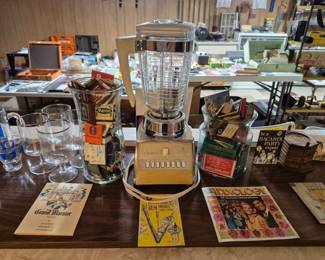 Vintage blender, matchbook collection and drink guides.