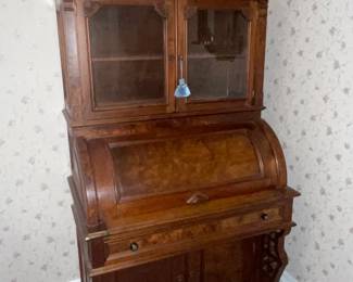 Walnut cylinder roll secretary With bookcase top