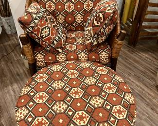 Wicker Armchair with Ottoman – Southwestern Upholstery
This sturdy wicker armchair with matching ottoman is upholstered in a bold Southwestern geometric fabric in warm earth tones of red, ivory, and black. The set includes the chair, ottoman, and coordinating accent pillows for a complete look.

Condition: Very good, minimal wear, cushions are firm and fabric is clean.

Dimensions:
	•	Chair: approx. 34” W x 36” H x 32” D
	•	Ottoman: approx. 24” diameter x 16” H

