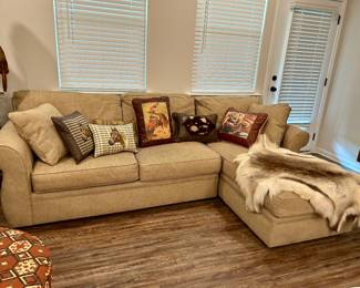 This neutral-toned Broyhill sectional sofa offers both style and comfort, perfect for a cozy living room or den. Upholstered in a durable beige fabric, it features deep cushions, wide arms, and a right-side chaise lounge for ultimate relaxation.

Condition: Excellent, gently used with no rips, stains, or sagging. From a smoke-free home.

Dimensions: Approx. 8 ft wide x 3.5 ft deep (chaise 6 ft deep).