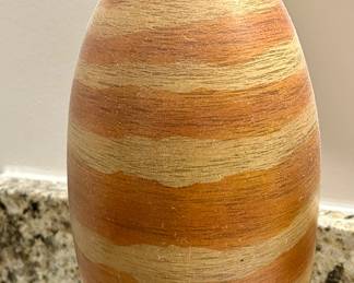 Handcrafted Southwestern Pottery Vase
Beautiful handcrafted pottery vase featuring natural striations in warm desert hues of terracotta, sand, and clay. The organic, layered finish evokes the look of sandstone and makes this piece a perfect accent for rustic, southwestern, or lodge-inspired décor.

Condition: Excellent, no chips or cracks.

Dimensions: Approx. 10” H x 6” W