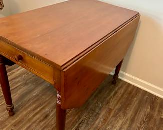 Vintage Drop-Leaf Table with Drawer
Solid wood drop-leaf table with beautifully turned legs and single center drawer. A versatile piece that works as a dining table, work table, or console—compact when folded, generous surface when extended. Warm finish with timeless farmhouse appeal.