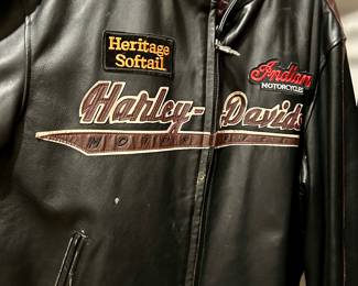 Vintage Harley-Davidson leather jacket with embroidered logos.