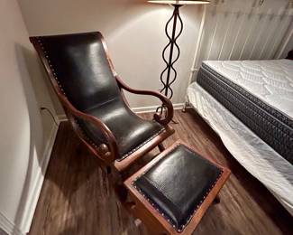 Vintage Curule-Style Lounge Chair & Ottoman
Solid wood frame with sweeping arms and X-form legs, paired with the original black leather upholstery and brass nailhead trim. Comes with matching ottoman.