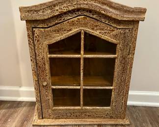 Rustic Primitive Wall Cabinet
Charming rustic wall cabinet with arched top and glass-front door in a windowpane style. Features distressed finish for authentic farmhouse appeal. Perfect for displaying collectibles, spices, or small décor items in a kitchen, bath, or living space.