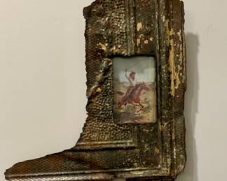 Rustic Boot-Shaped Wall Frame with Cowboy Print
One-of-a-kind rustic wall art piece crafted in the shape of a cowboy boot.

Dimensions: Approx. 16” H x 11” W

