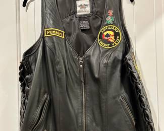 Harley-Davidson Women’s Leather Vest – Customized w/ Military & Biker Patches

Authentic Harley-Davidson leather vest (Medium) with side lacing and zip front, uniquely decorated with Auxiliary Combat Vets, U.S. Navy, and biker patches. A one-of-a-kind piece blending Harley culture with veteran heritage.