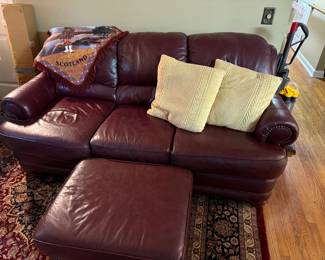 Burgundy couch with ottoman