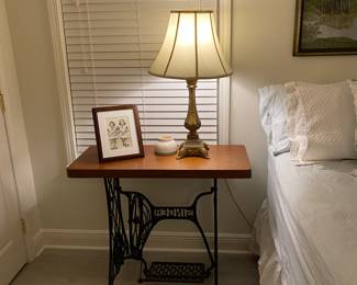 Antique sewing machines table.  Top is thick mahogany.