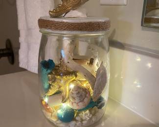 Coastal decor
Decorative jar of shells
Multi-colored