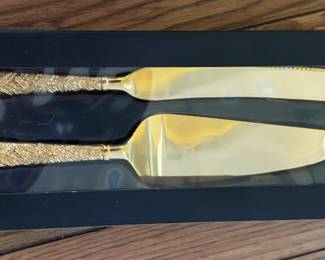Gold serving set. Used once.