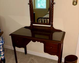Classic vanity with a small cushioned seat 