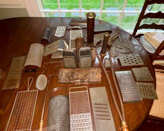 Large collection of antique graters and utensils 