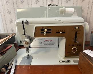 Vintage blue Singer sewing machine , table and chair.
