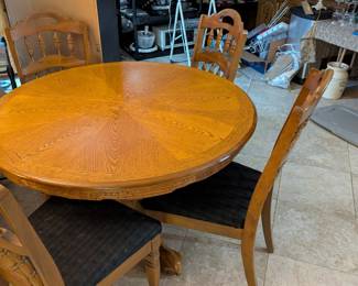 round dinner table with 4 chairs