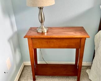 Wooden Nightstand + Lamp
Matching wooden nightstand with lower shelf and a neutral table lamp. Perfect for bedside use.