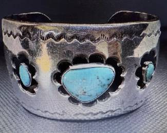  Three turquoise cabochons resting in smooth silver bezels. Pictures do not do the jewelry justice. For more details go to: https://modestlambestatesales.hibid.com/